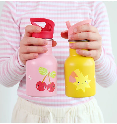 Two children's water bottles, one pink with cherry design and one yellow with sun design, held by a child in a striped shirt.